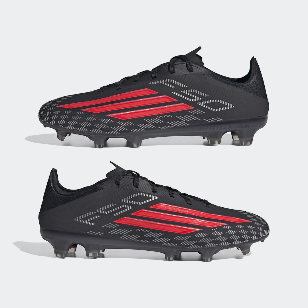 Pair of black and red Adidas F50 Pro Firm Ground Football Boots in a side-profile view, featuring the iconic three stripes.
