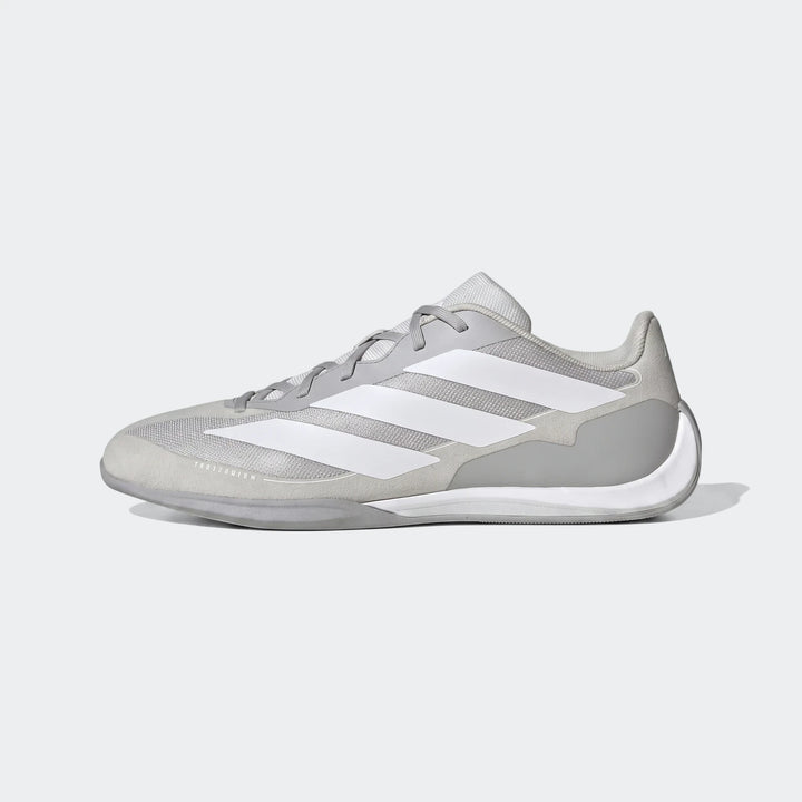 Grey and white Adidas Feroza Base athletic shoes, featuring three white stripes and a lightweight design, displayed in a