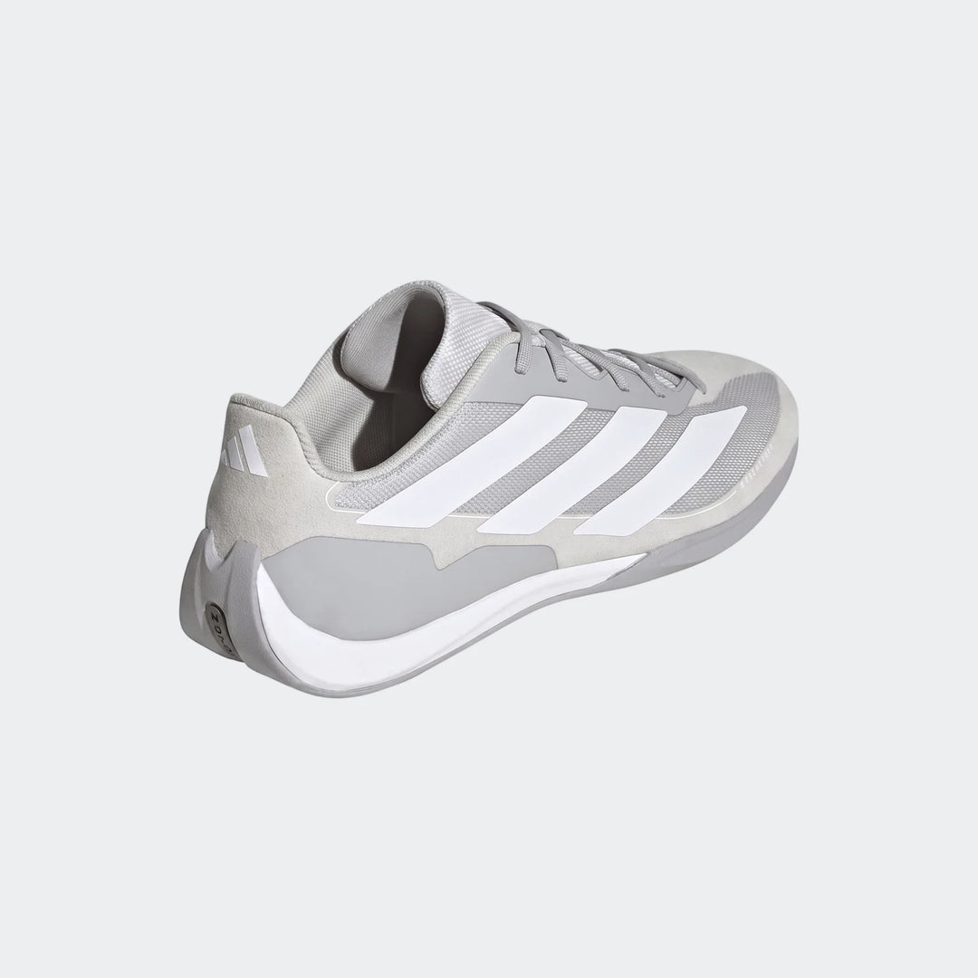 A single grey and white Adidas Feroza Base Shoe, shown floating in a side view, highlighting its textured upper, white