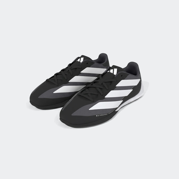 A pair of black and white Adidas Feroza Base Shoes for motorsport, featuring classic three stripes and a low-profile