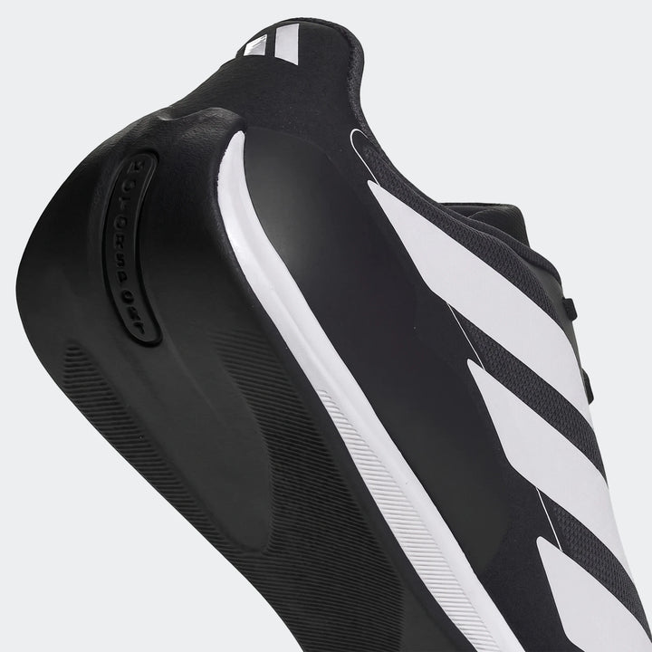 Adidas Feroza Base Shoes in black and white with signature stripes and a textured sole, captured from a side-rear angle.