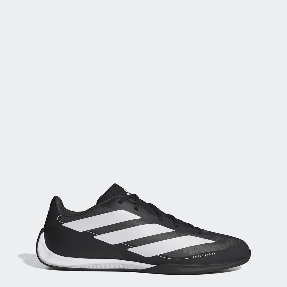 Adidas Feroza Base Shoes in black and white, featuring three stripes and 'MOTORSPORT' branding, viewed from the side.