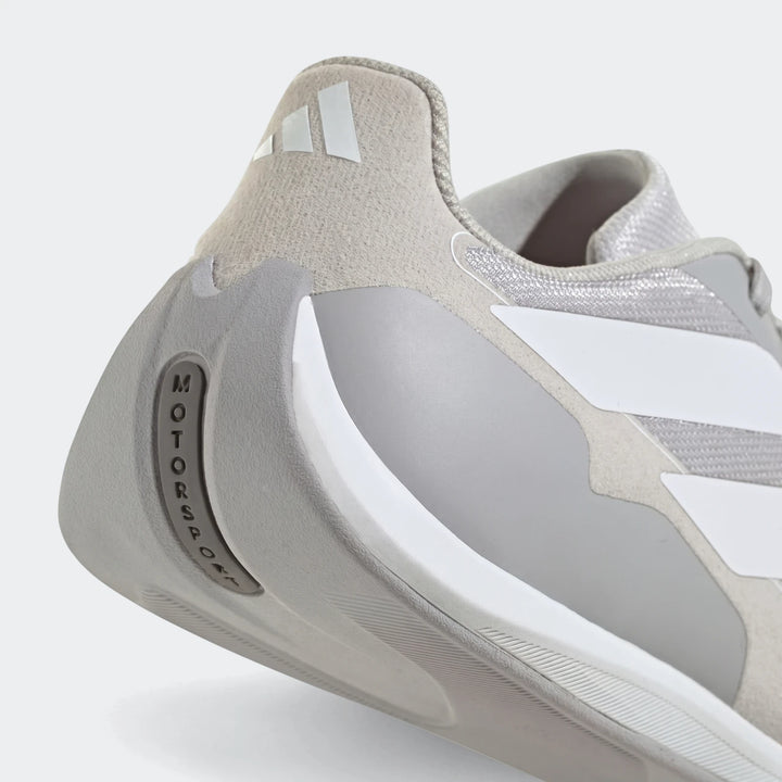 Adidas Feroza Base shoes in light gray and white, showcasing the heel and side with "MOTORSPORT" detail.
