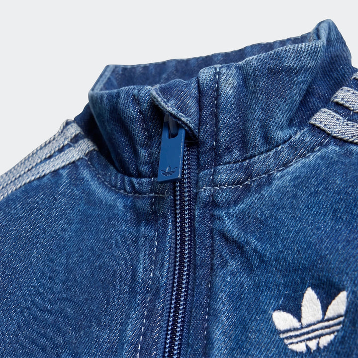 Close-up of an Adidas Firebird Denim Track Top in blue, showcasing the detailed denim fabric, zipper, collar, and