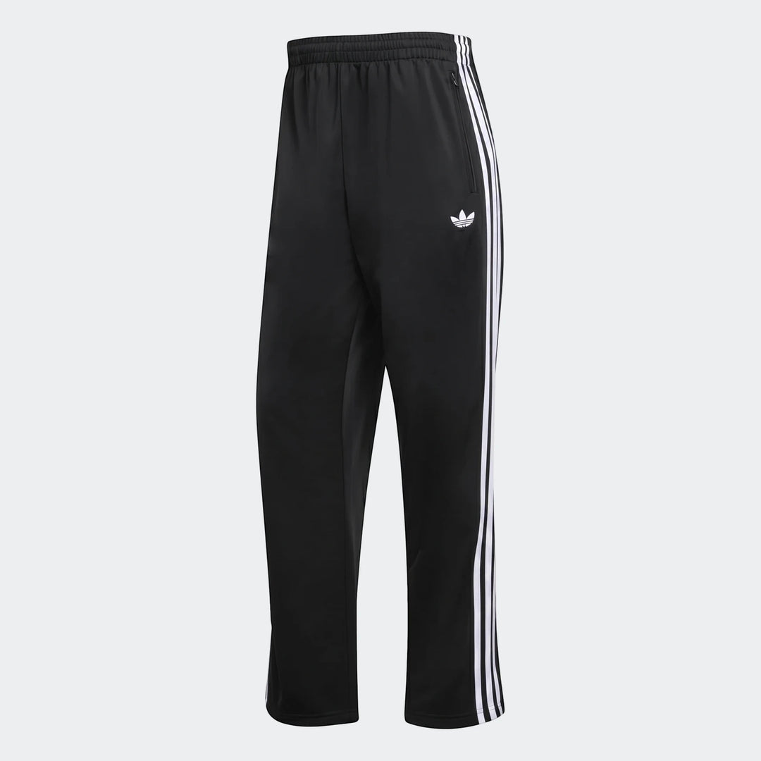Black Adidas Firebird track pants with white three-stripes and Trefoil logo, shown from a slightly angled view.
