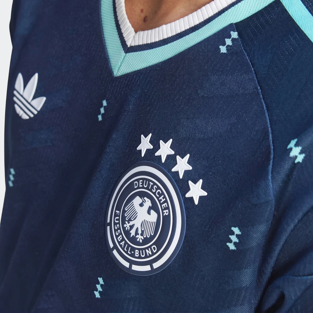 Close-up of the dark blue Adidas Germany 26 Away Authentic Jersey, featuring the DFB crest and four white stars.