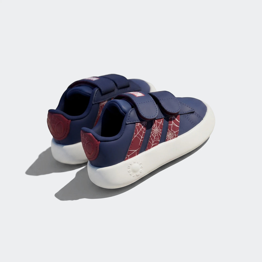 Pair of kids' Adidas Grand Court Spider-Man Cloudfoam shoes in navy blue, red, and white with velcro straps, viewed from an
