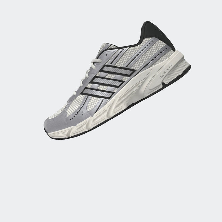 Adidas grey and black mesh running shoe with white laces and a textured sole, presented in an angled view.