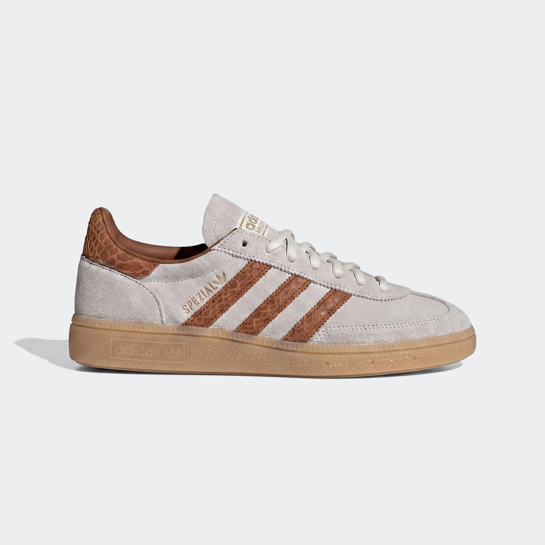 Adidas Handball Spezial Shoes in off-white suede with brown stripes and gum sole, shown in a side view.