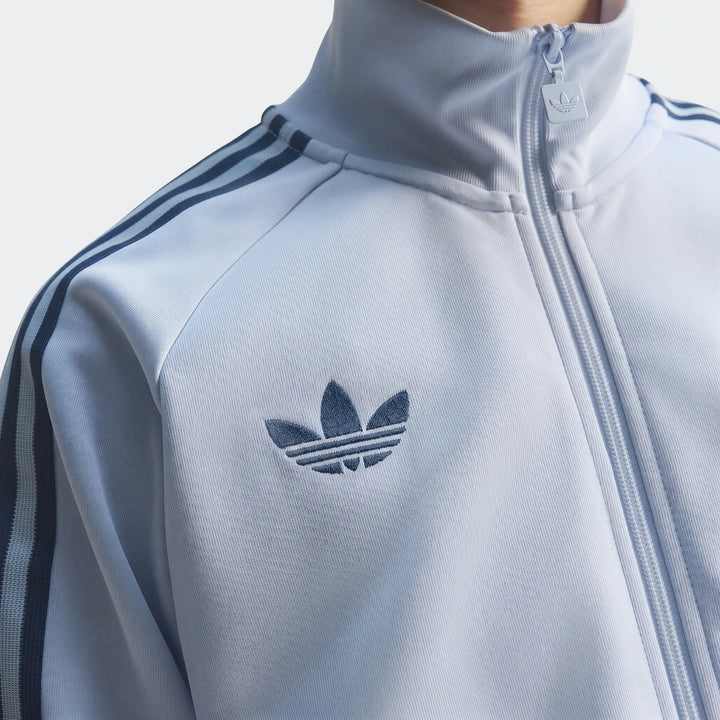 Light blue Adidas Italy Originals Track Top worn by a person, featuring the iconic embroidered Trefoil logo and three