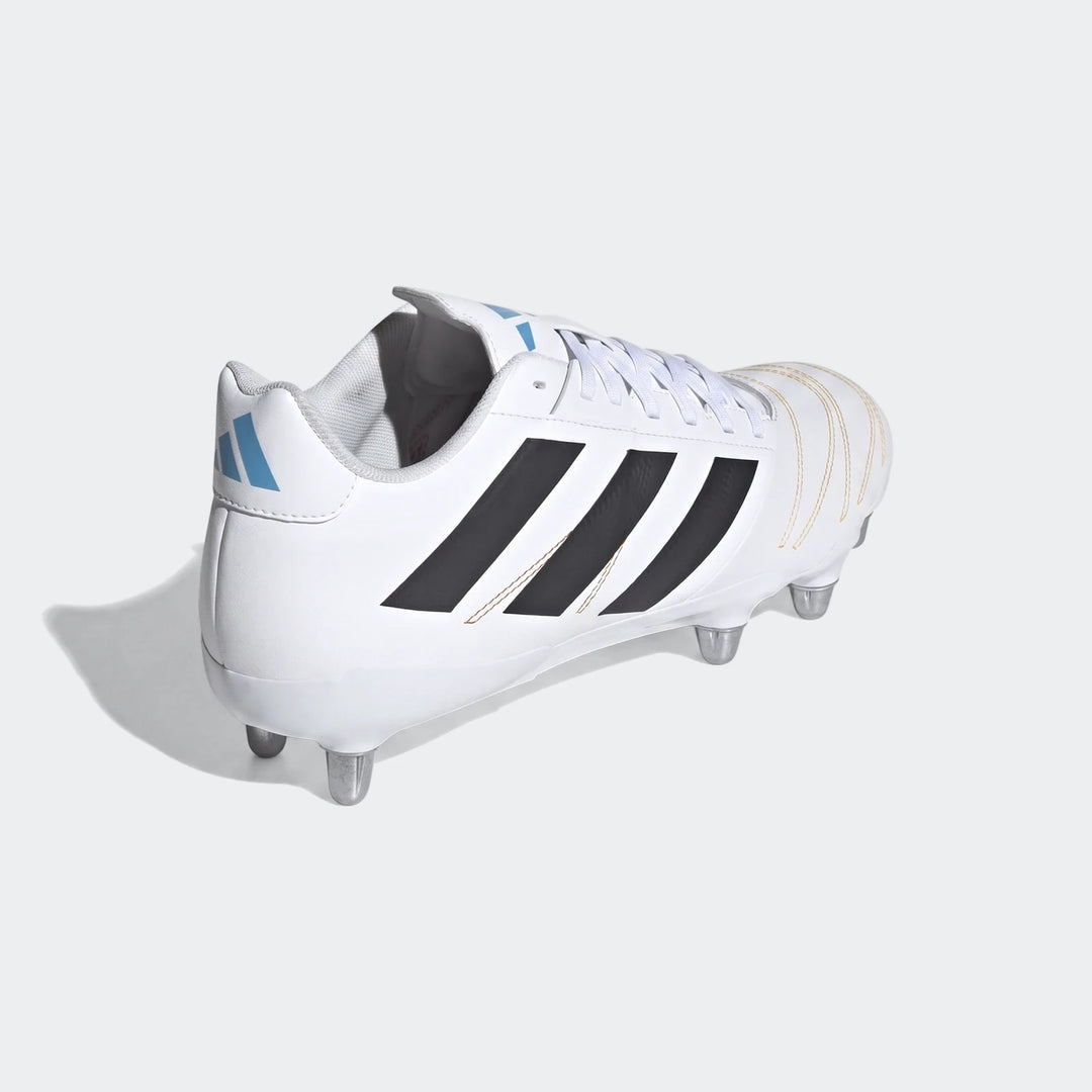 White Adidas Kakari Elite SG rugby boots with black stripes and light blue logo, shown from a rear-right quarter view.