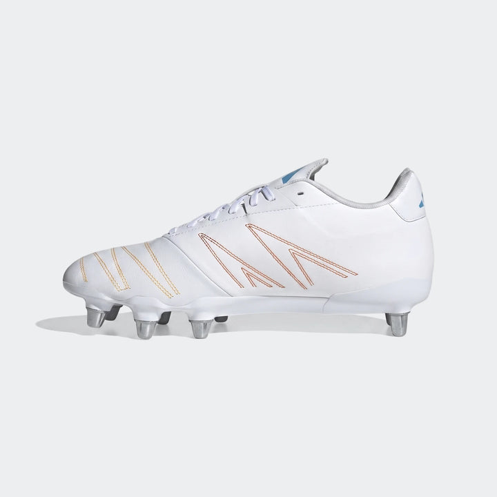 White Adidas Kakari Elite Sg Rugby Boots with orange and yellow stitching and silver studs, shown from a side view.
