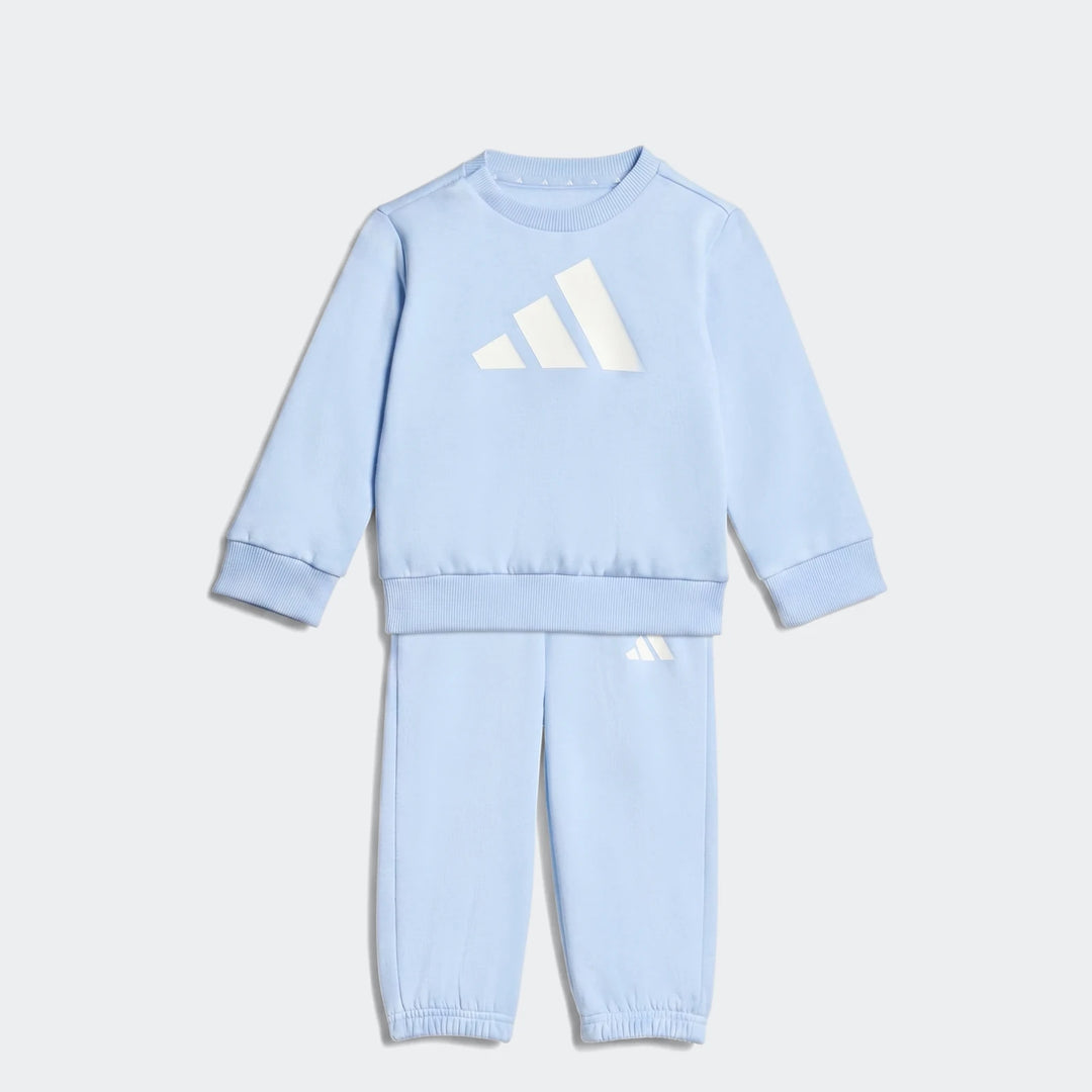 Light blue Adidas Kids Essentials sweatshirt and joggers set, featuring a large white logo on the chest and a smaller logo
