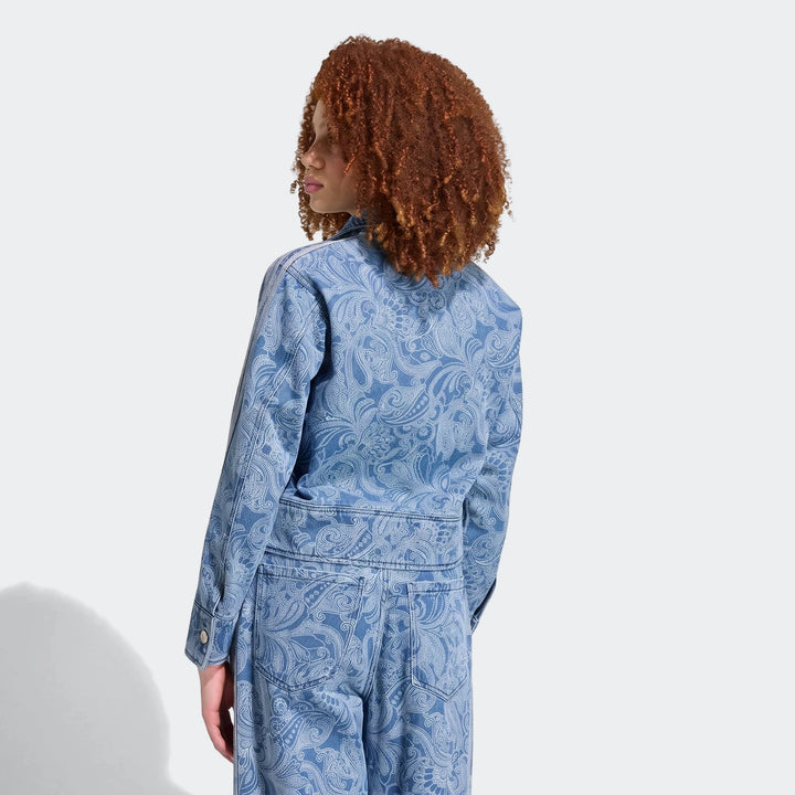 Adidas Liberty London Firebird Denim Tracktop with matching paisley print pants, seen from the back on a model with curly