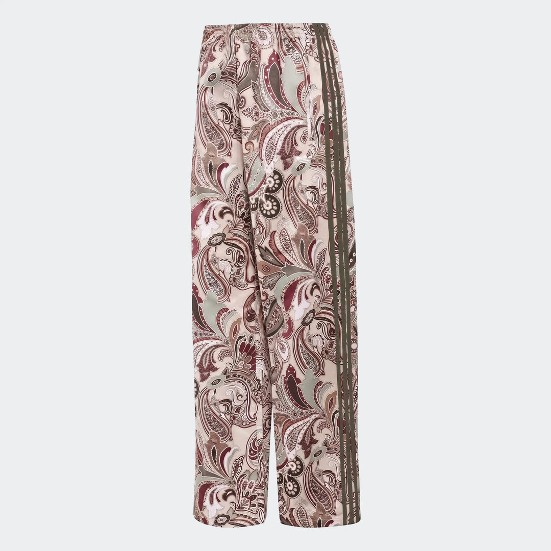 Adidas Liberty London Firebird satin trackpants in an all-over beige and burgundy paisley print with dark green side