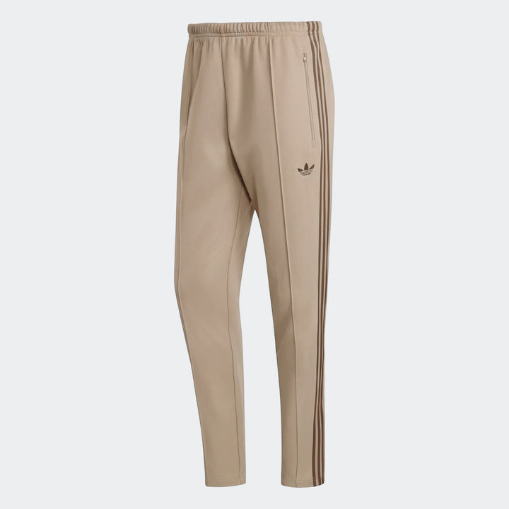 Beige men's Adidas Classic Track Pants with brown three-stripe detail and trefoil logo, front view.