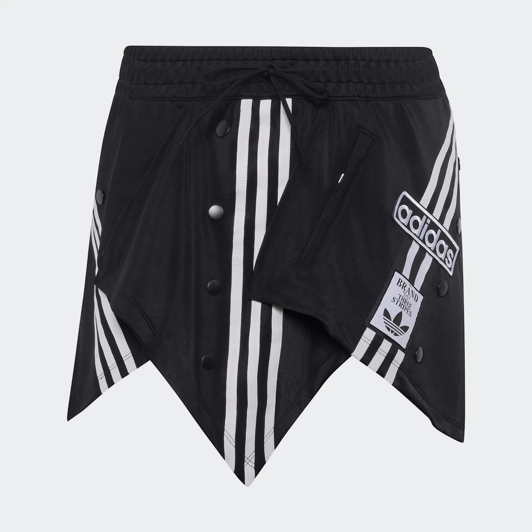 Black Adidas X Mia Marquez mini skirt featuring white three-stripes, matte snap buttons, and an asymmetrical hem.