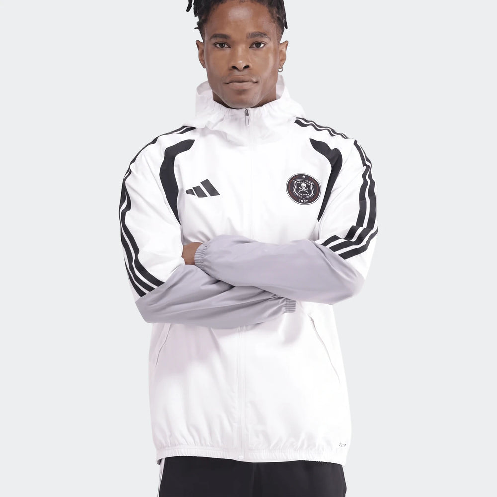 Men's white, black, and grey Adidas Op Tiro26C Aw Jkt with hood, featuring team crest and stripes, shown on a model.