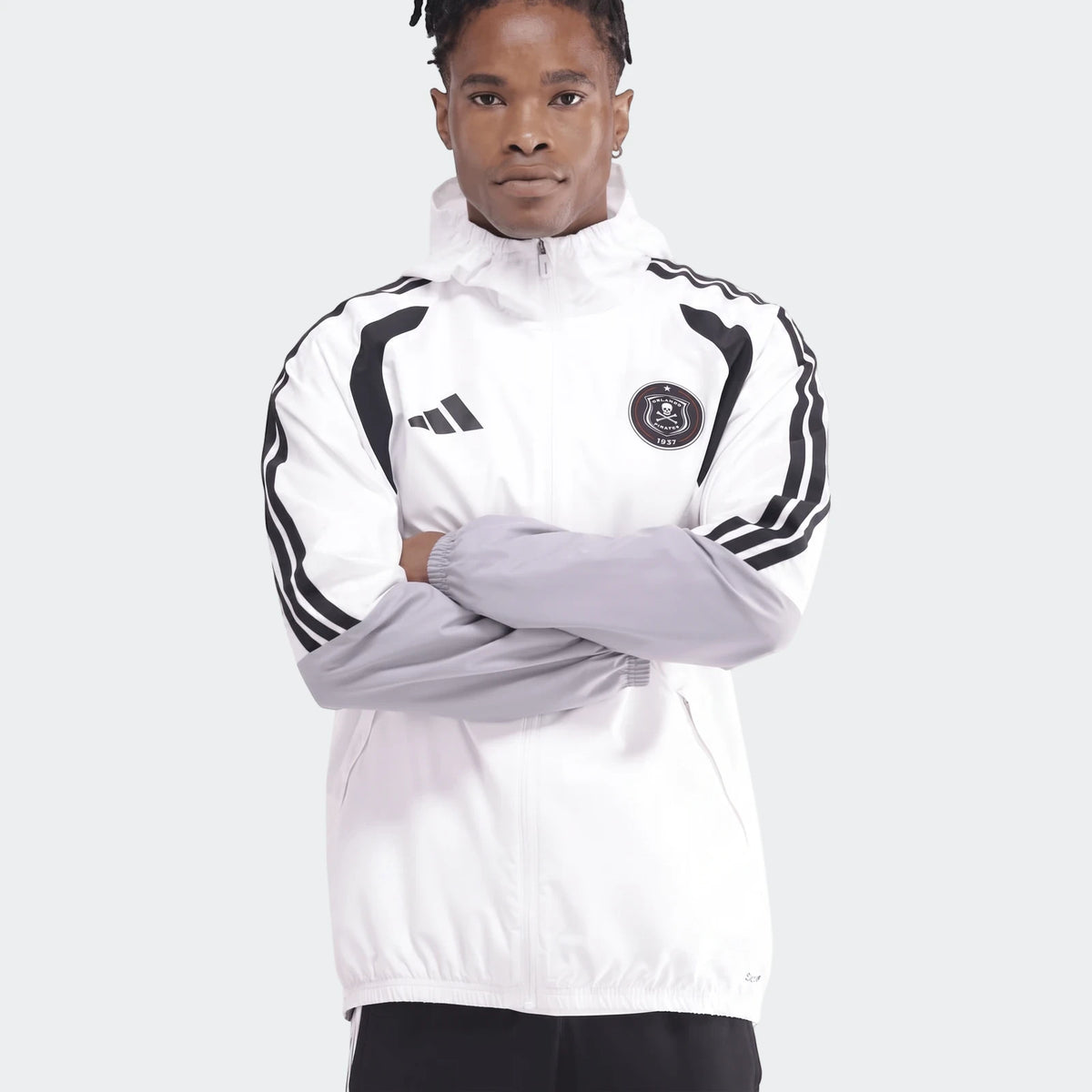 Men's white, black, and grey Adidas Op Tiro26C Aw Jkt with hood, featuring team crest and stripes, shown on a model.