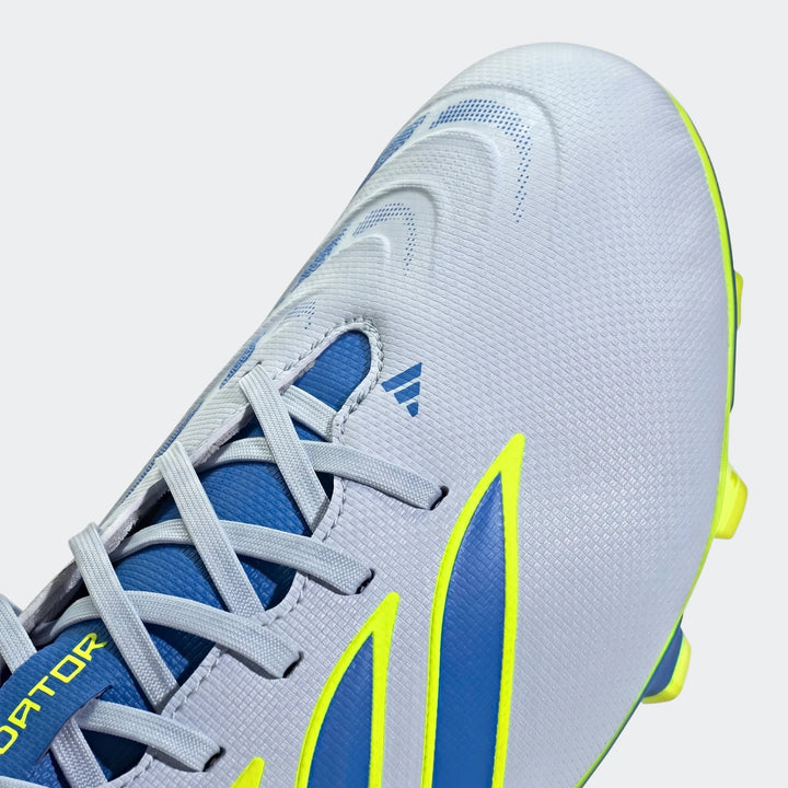 Close-up view of a white, blue, and neon yellow Adidas Predator Club Firm Ground / Multi Ground Football Boot, showcasing