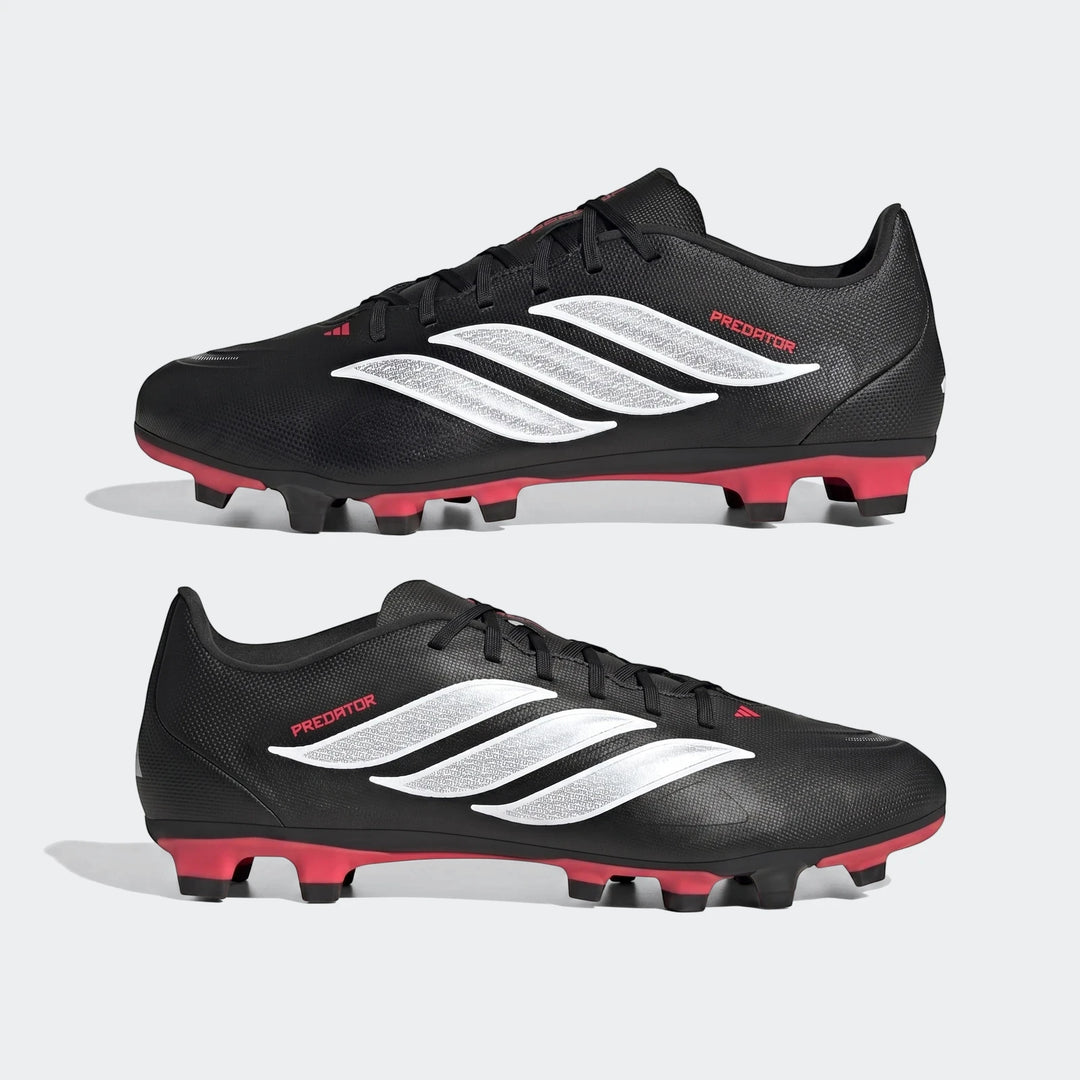 Pair of Adidas Predator Club firm ground multi ground football boots in black with white stripes and red cleats, shown from