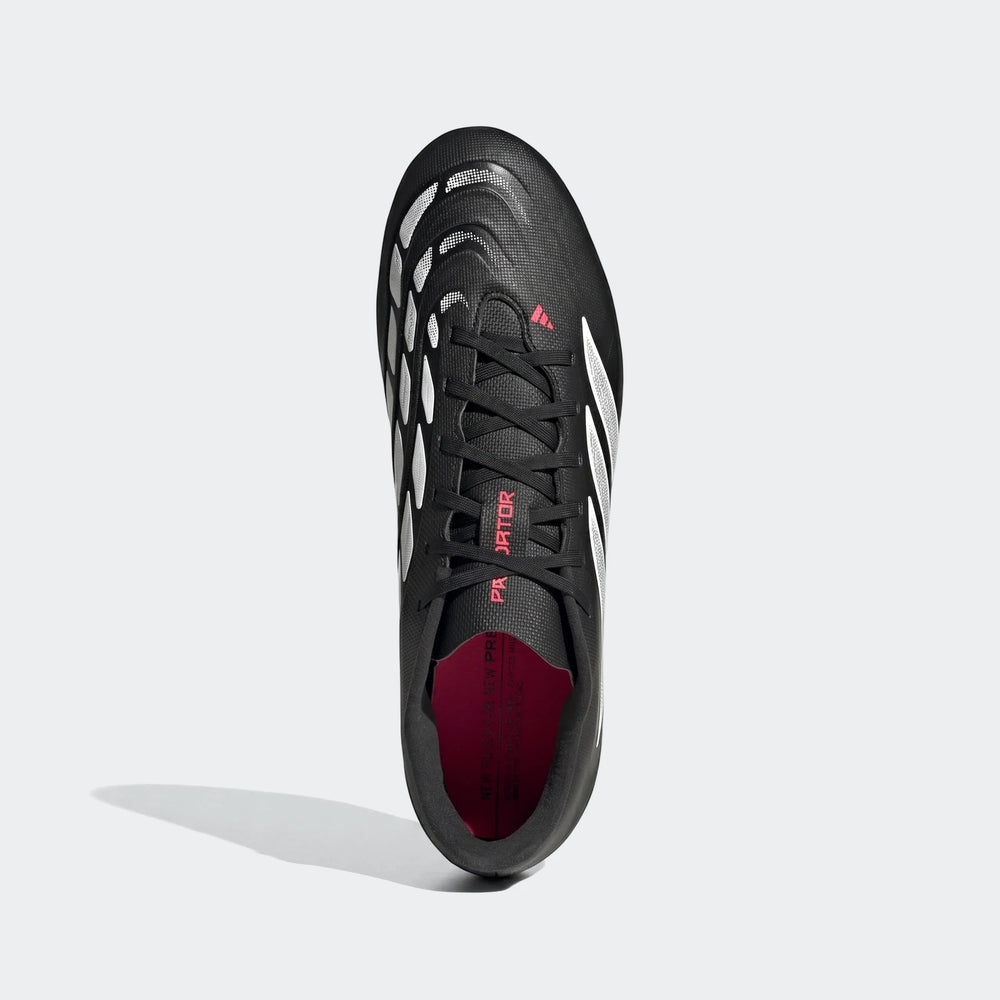 Black and white Adidas Predator Club football boots with pink accents, shown from a top-down perspective.