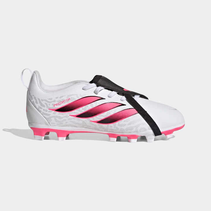 White Adidas Predator Club kids football boots with pink stripes, a black fold-over tongue, and pink firm ground studs,