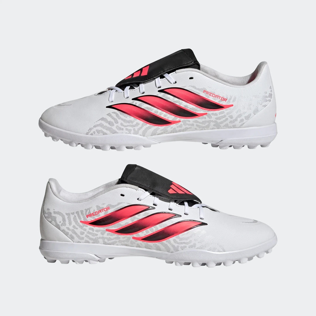 Pair of Adidas Predator Club Fold-Over Tongue Turf Football Boots in white and pink, shown from a side view.