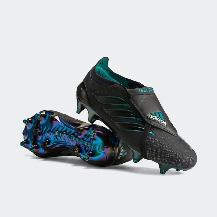 Pair of black Adidas Predator Elite Ft SG EQT football boots with teal accents and iridescent soles, one upright and one on