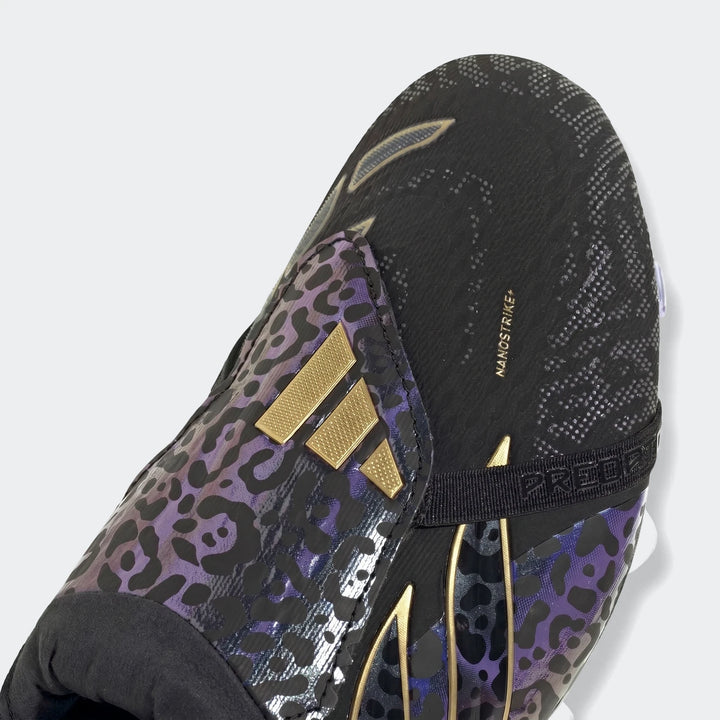 Black and purple leopard print Adidas Predator Elite Ft Fg Kaka Edition football boots with gold stripes, seen in a close-up.