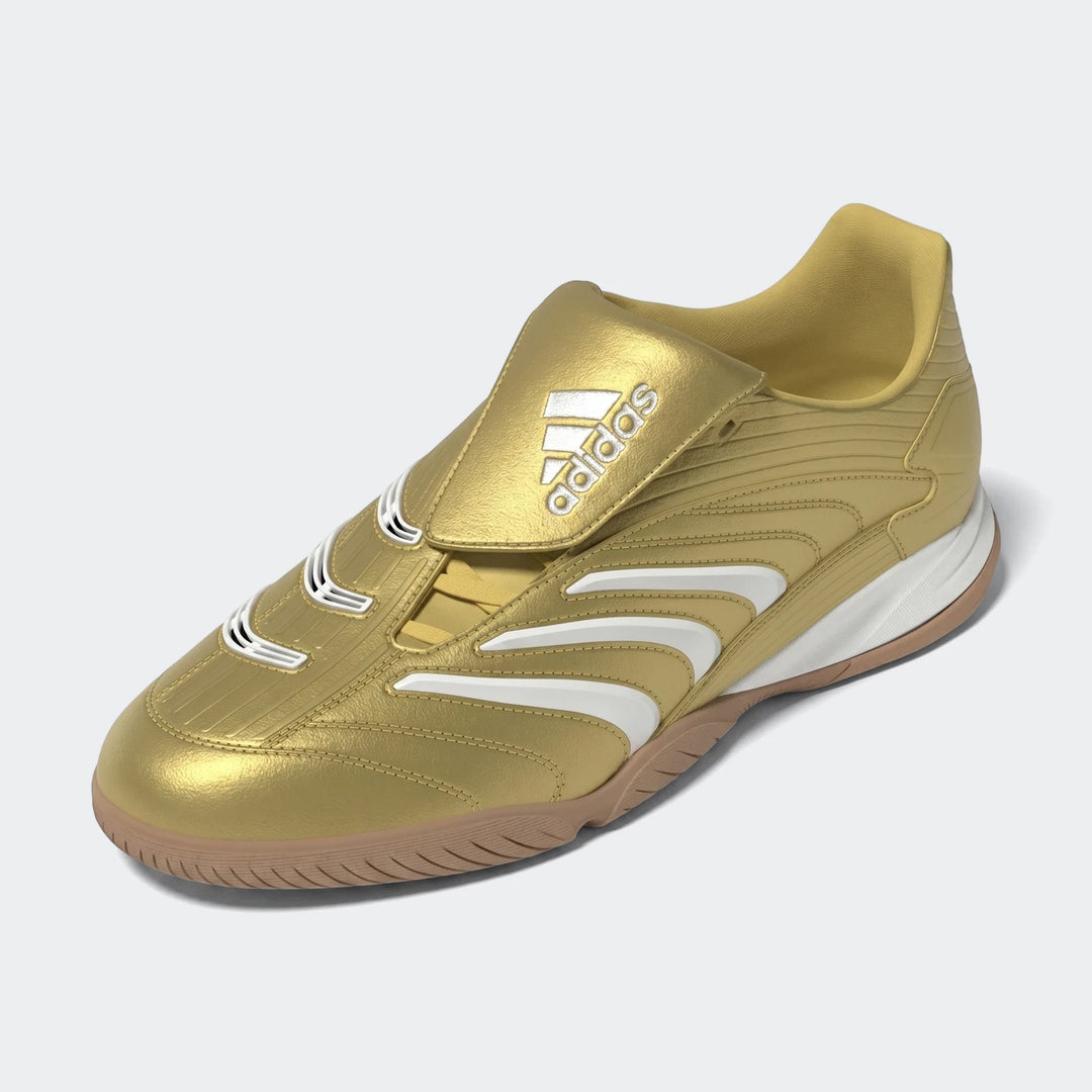 Gold Adidas Predator Sala indoor football boots with white stripes and a tan sole, viewed from a high angle.