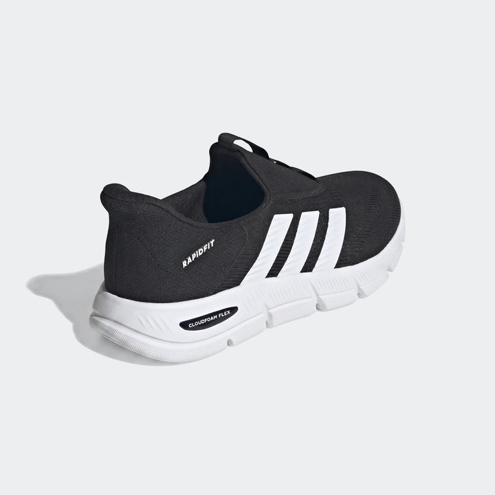 Black Adidas Rapidfit sneaker with white stripes and a white Cloudfoam Flex sole, shown from a side angle.