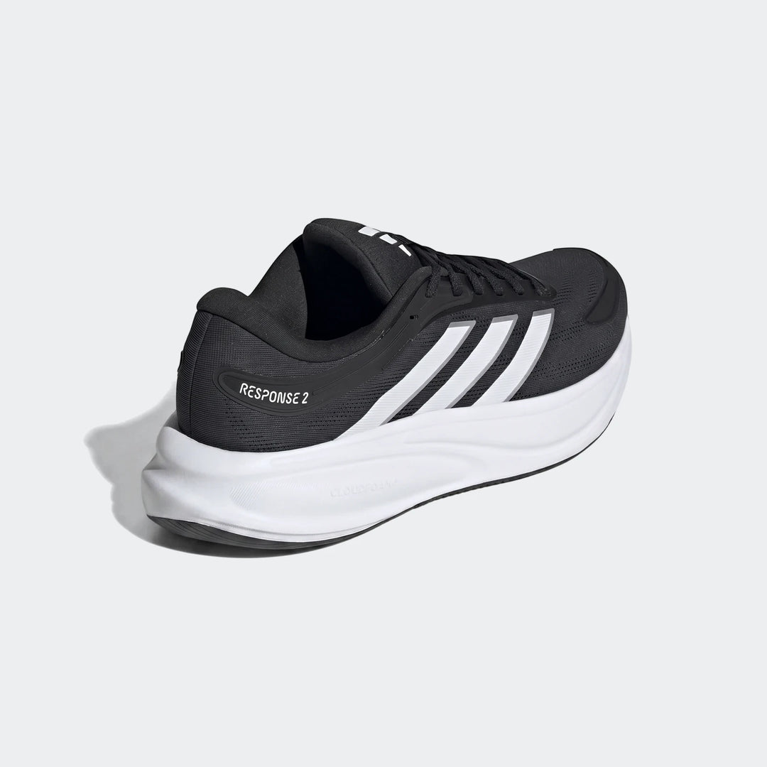 Adidas Response 2 Running Shoes in black and white, featuring white stripes and a thick white sole, viewed from the