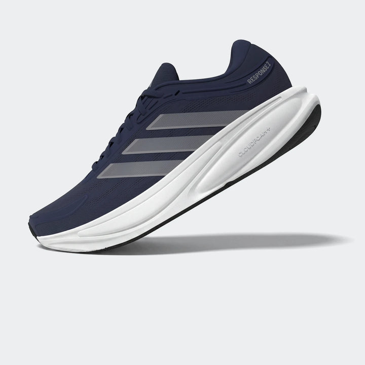 Adidas Response 2 running shoes in navy blue with white Cloudfoam+ midsole and gray stripes, presented in a dynamic side