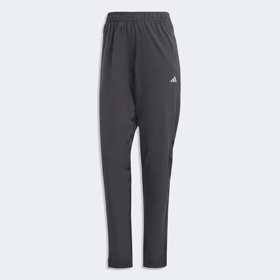 Dark gray Adidas Run It Tko Joggers, full length, with an elastic waistband and white logo on the thigh, presented on a