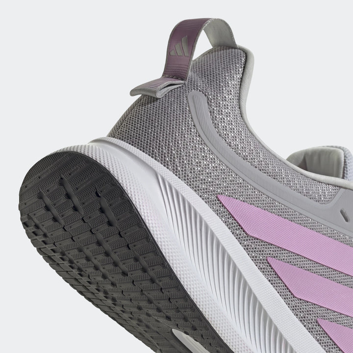 Close-up of the heel and sole of a grey and pink Adidas Runblaze W Running Shoe, showcasing the textured sole and mesh upper.