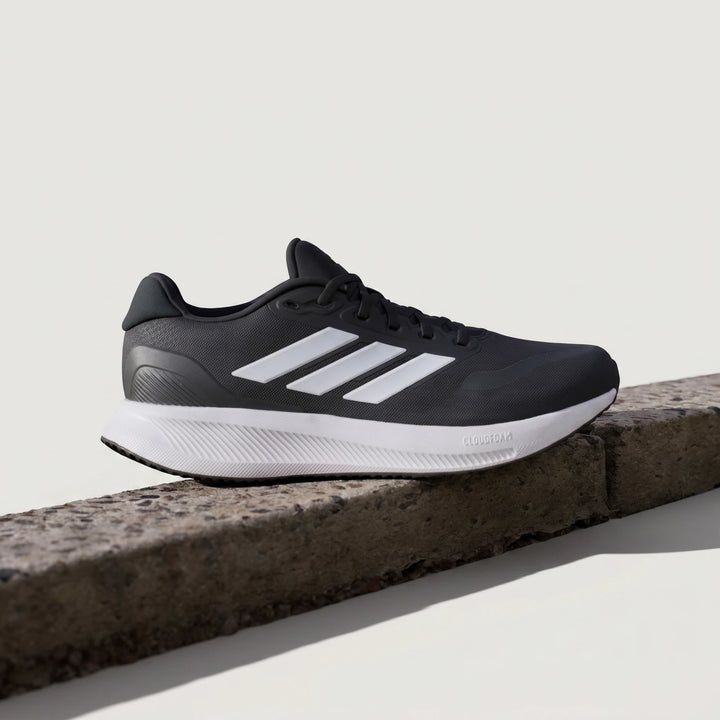 Adidas Runfalcon 5 Black Sneakers with prominent white stripes and a thick white Cloudfoam sole, captured in a clear side