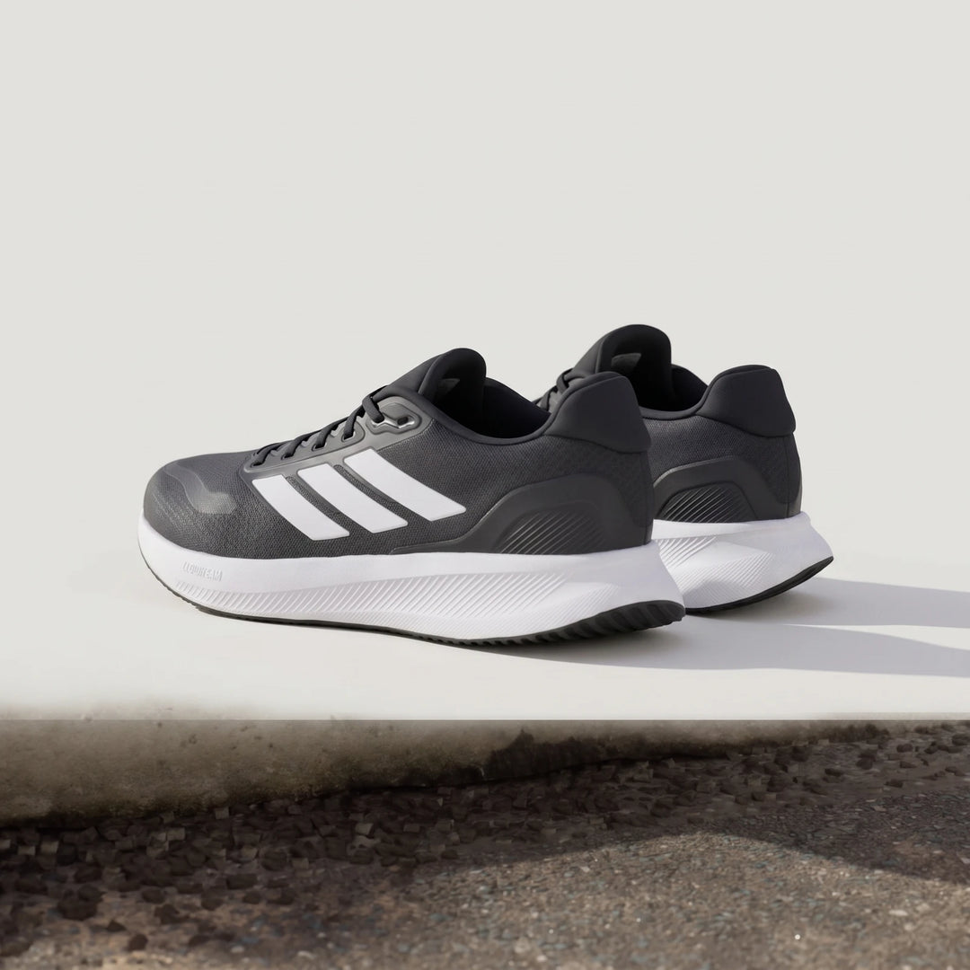 Adidas Runfalcon 5 Black Sneakers, featuring white three stripes and a white Cloudfoam midsole, in a low-angle side view.