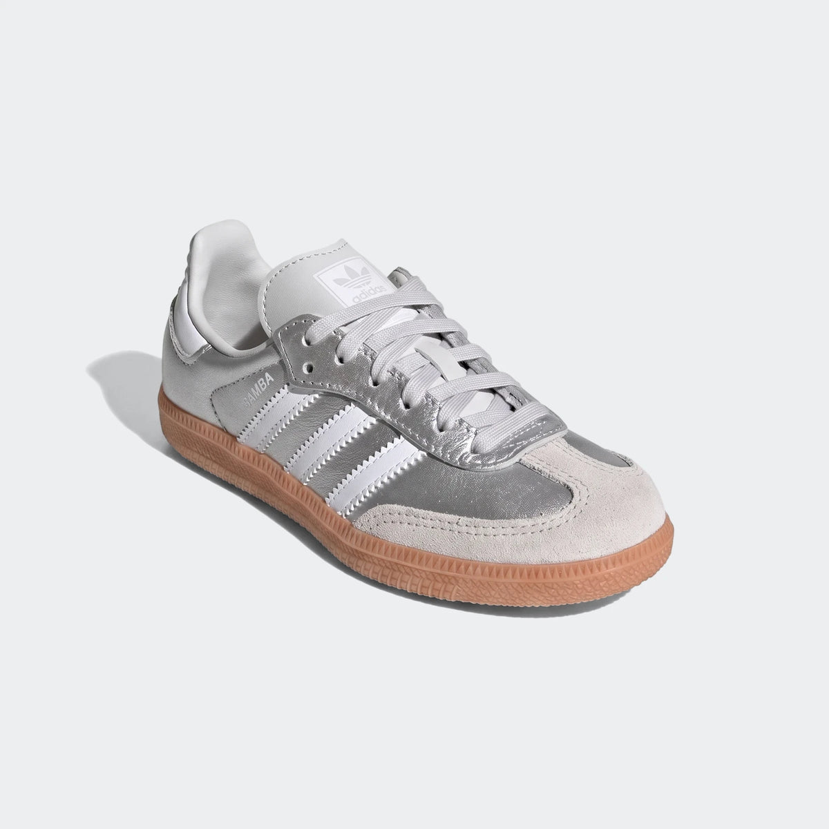 Adidas Samba Og Shoes in metallic silver with white stripes, light grey suede toe, and a gum sole, shown from a side view.
