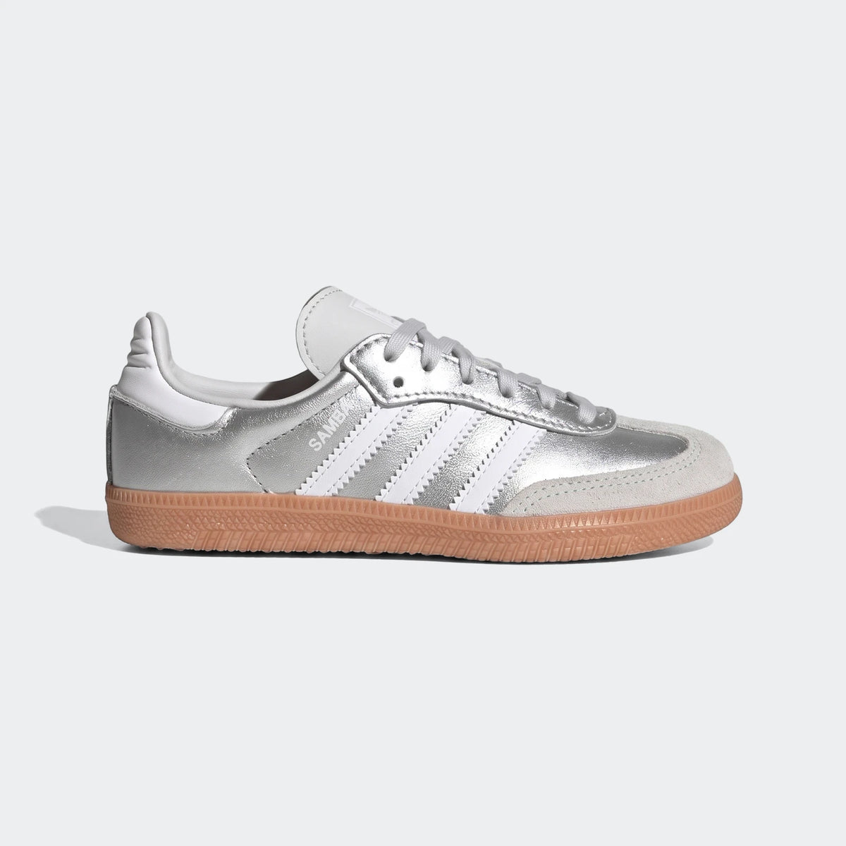 Adidas Samba Og Shoes in silver metallic with white stripes and a gum sole, displayed in a side profile view.