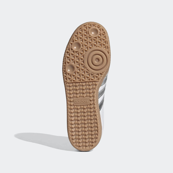 Adidas Samba OG shoes, sole view, with a brown gum sole featuring a distinct tread pattern and Adidas branding.
