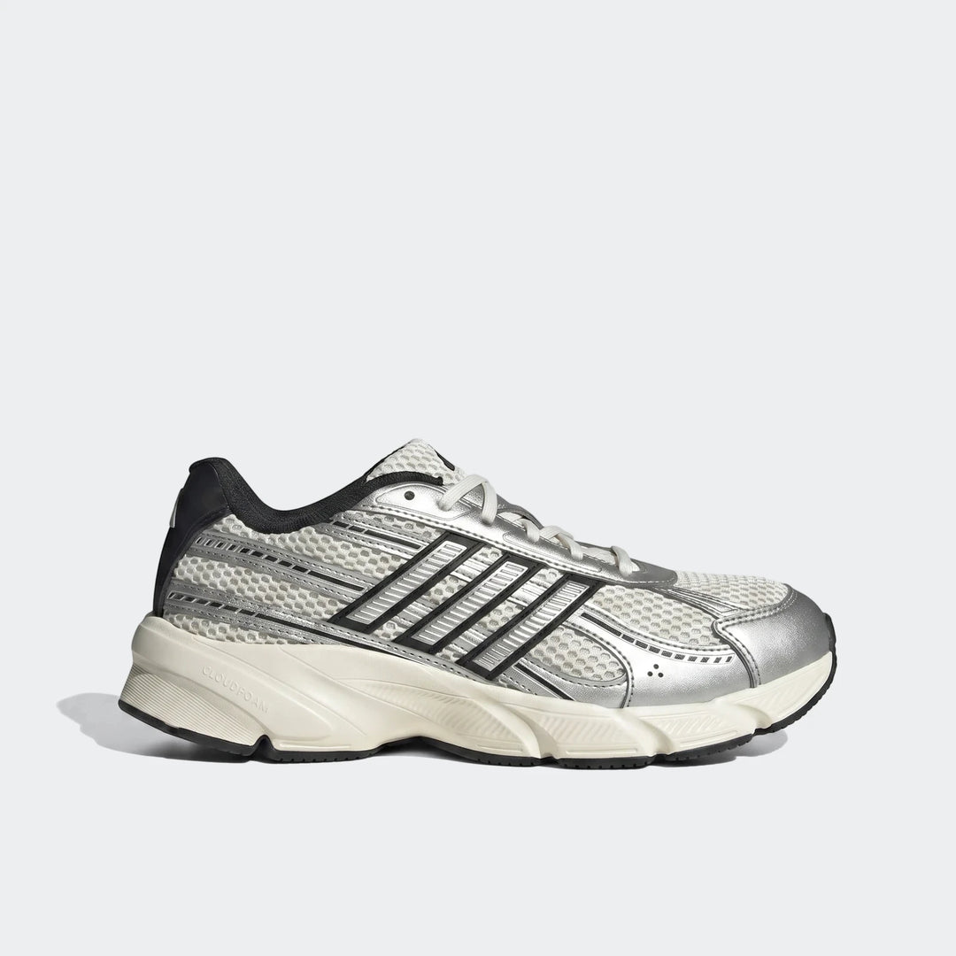 Adidas running sneaker, silver and white with black stripes, featuring mesh construction and a Cloudfoam midsole, shown in a