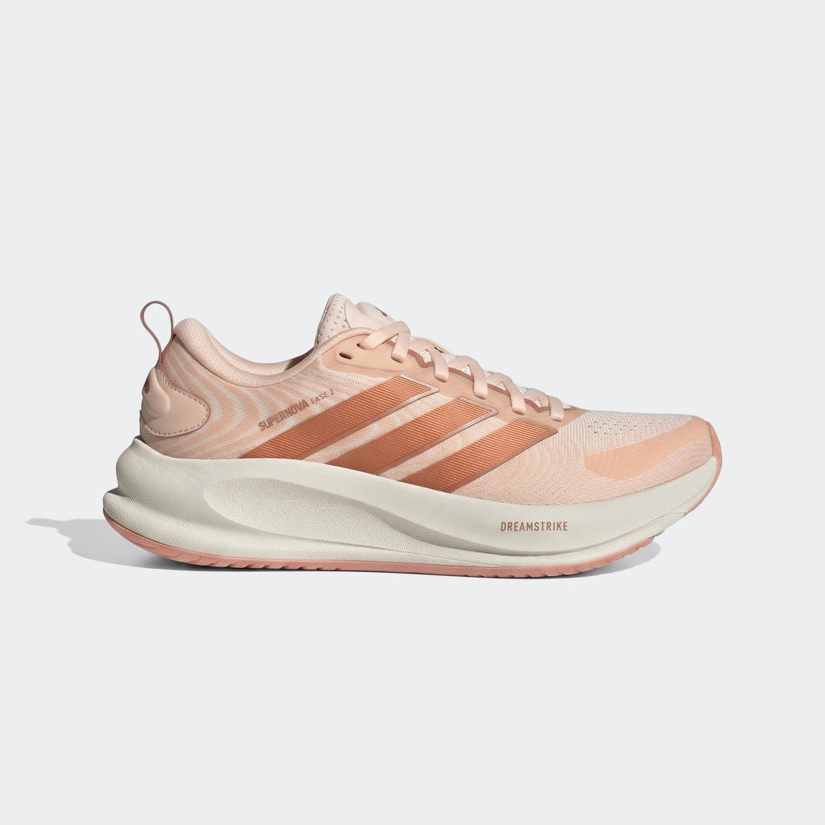 Light pink Adidas Supernova Ease 2 running shoe with cream sole, shown in a side profile view.