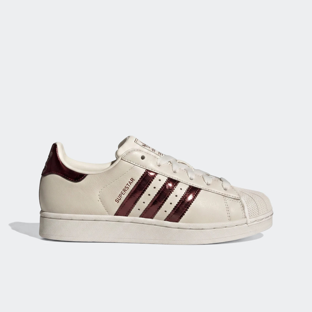 Adidas Superstar II Shoes in off-white leather with maroon stripes and shell toe, side view.