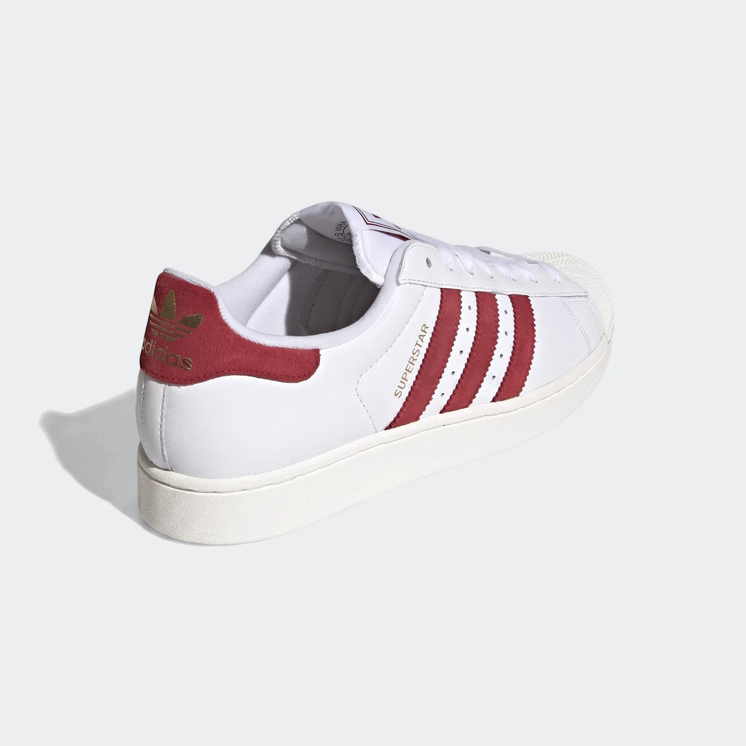 White and red leather Adidas Superstar II shoes, showcasing the iconic shell toe and three stripe design.