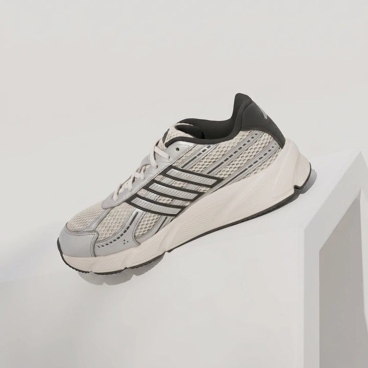Adidas Technochaos 2000 men's shoes in white, silver, and black, featuring a mesh upper and chunky sole, displayed from a