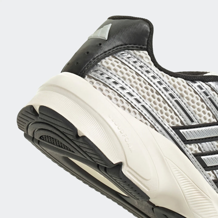 Close-up of Adidas Technochaos 2000 Shoes, showing the gray mesh upper, black heel with branding, and white Cloudfoam