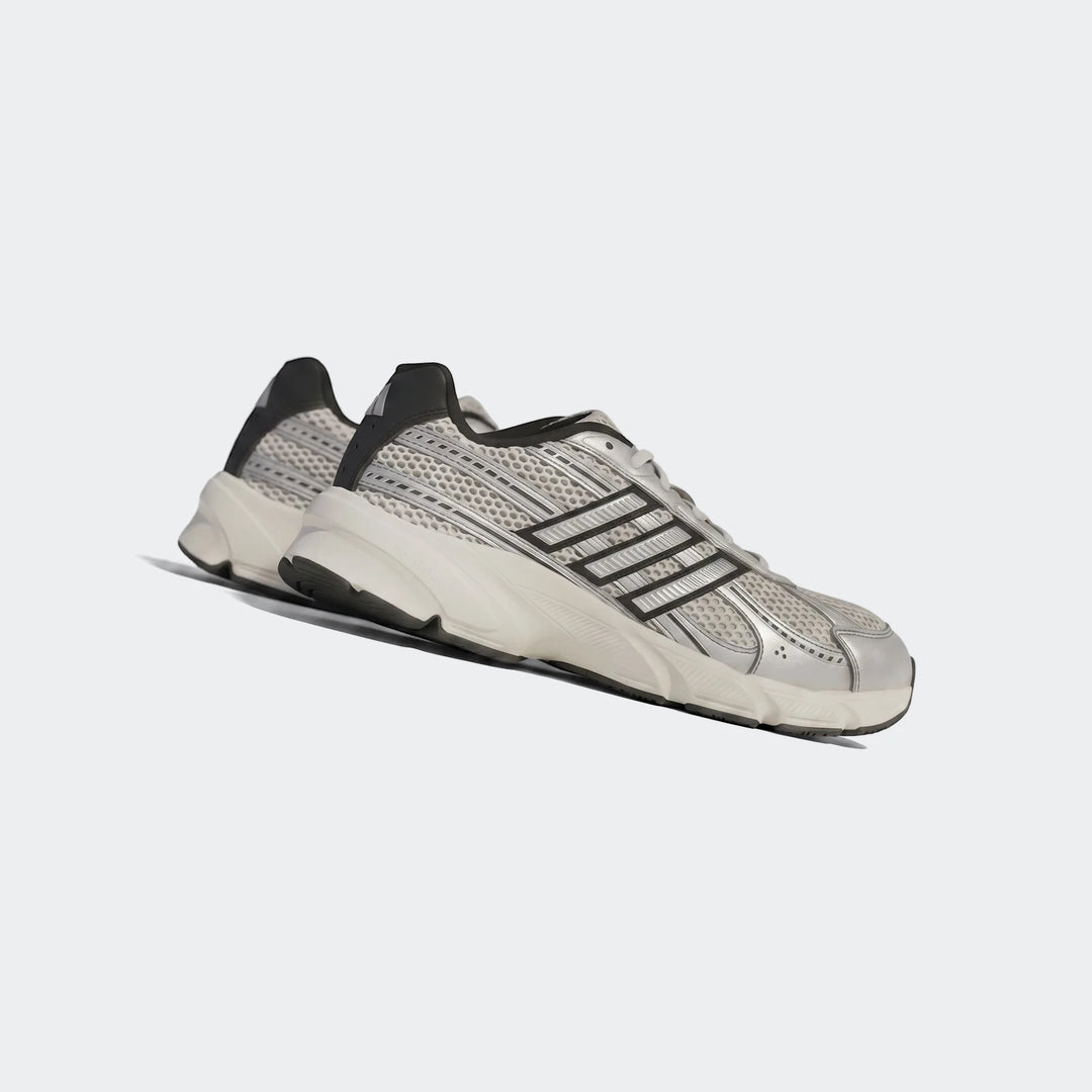 A pair of silver and black Adidas Technochaos 2000 Shoes, featuring a mesh upper and chunky white sole, shown from a side