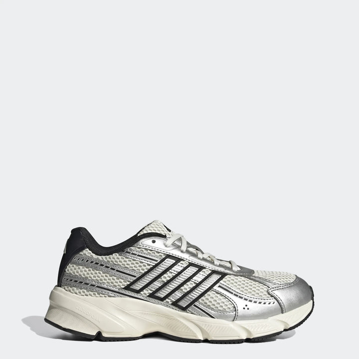 Adidas Technochaos 2000 Shoes in silver and white mesh with black stripes, side view. Classic running shoe design with