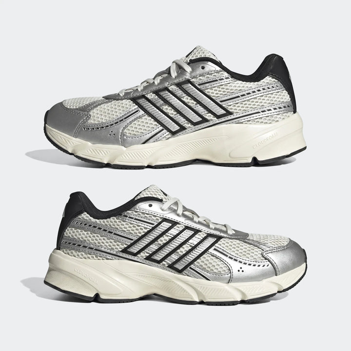 Pair of Adidas Technochaos 2000 athletic shoes in silver and white mesh with black accents, shown from the side.